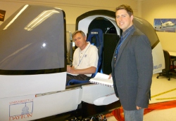 Photo - Roberto Morujo and Lt. Col James Hanley with flight sim